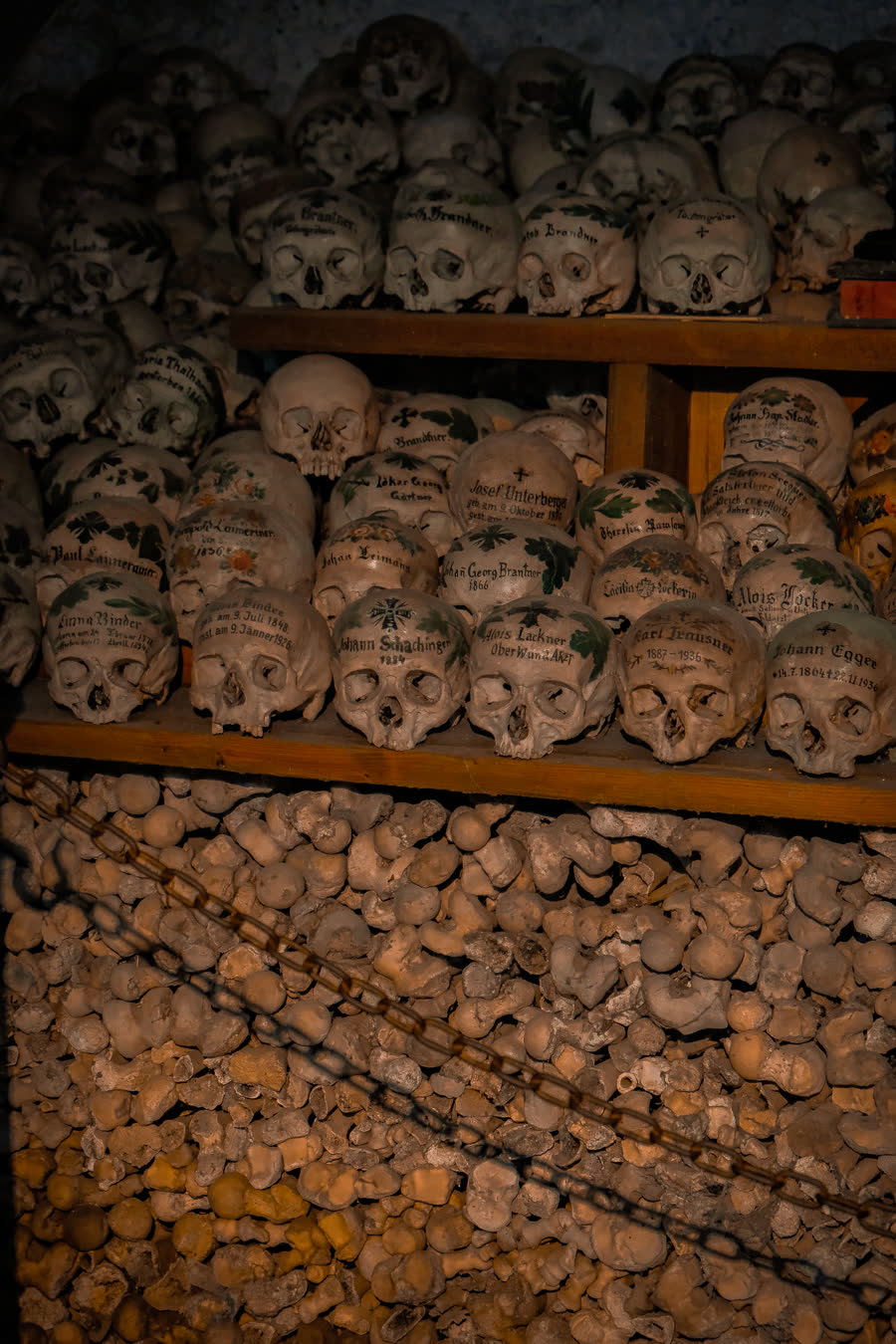 Shelves of stacked bones inside an ossuary