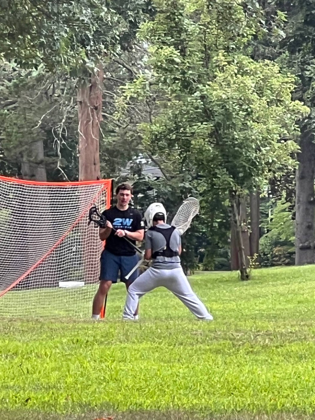 Jack Crombie working one on one with a young goalie