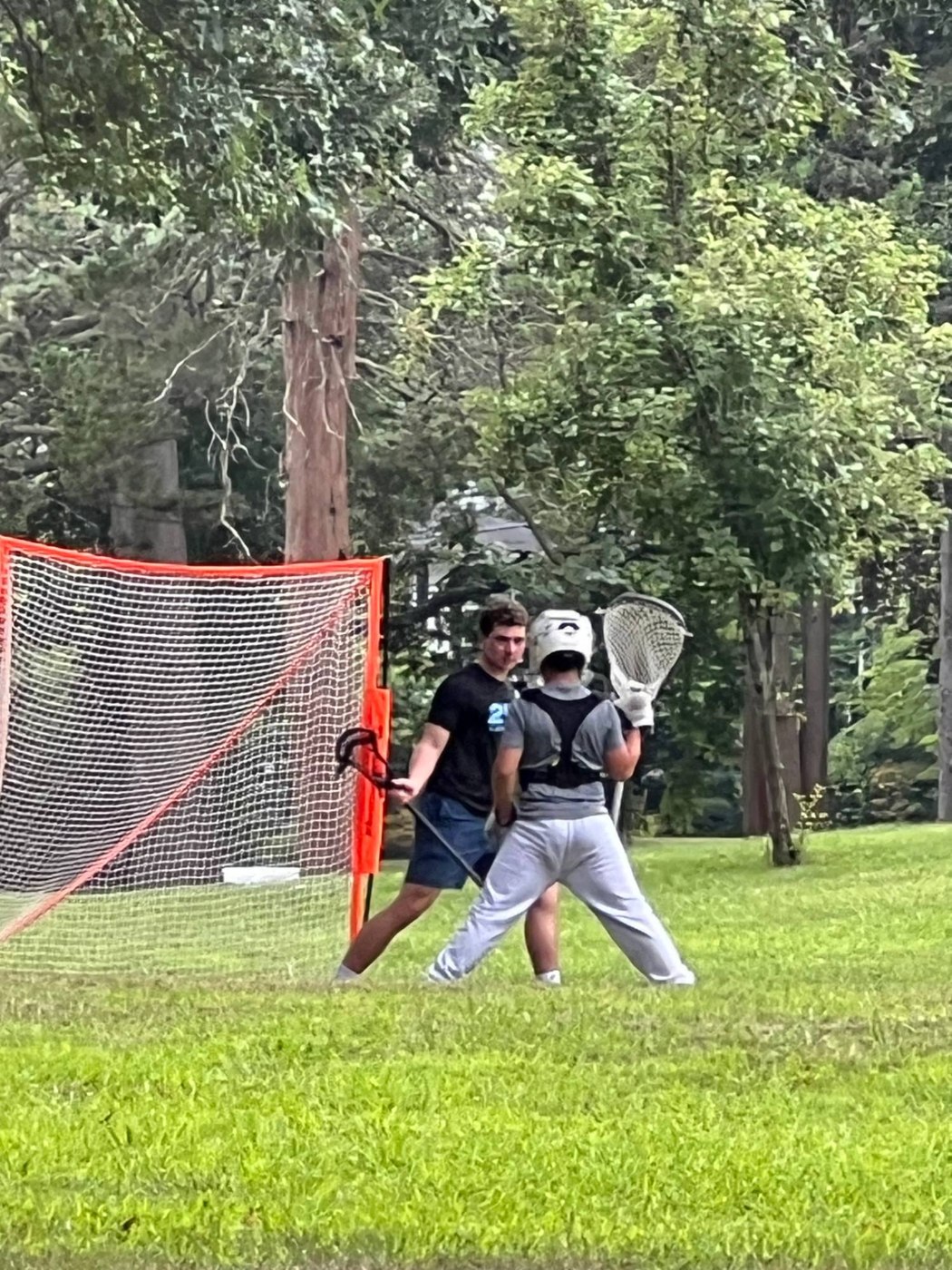 Jack Crombie running a drill with a young goalie