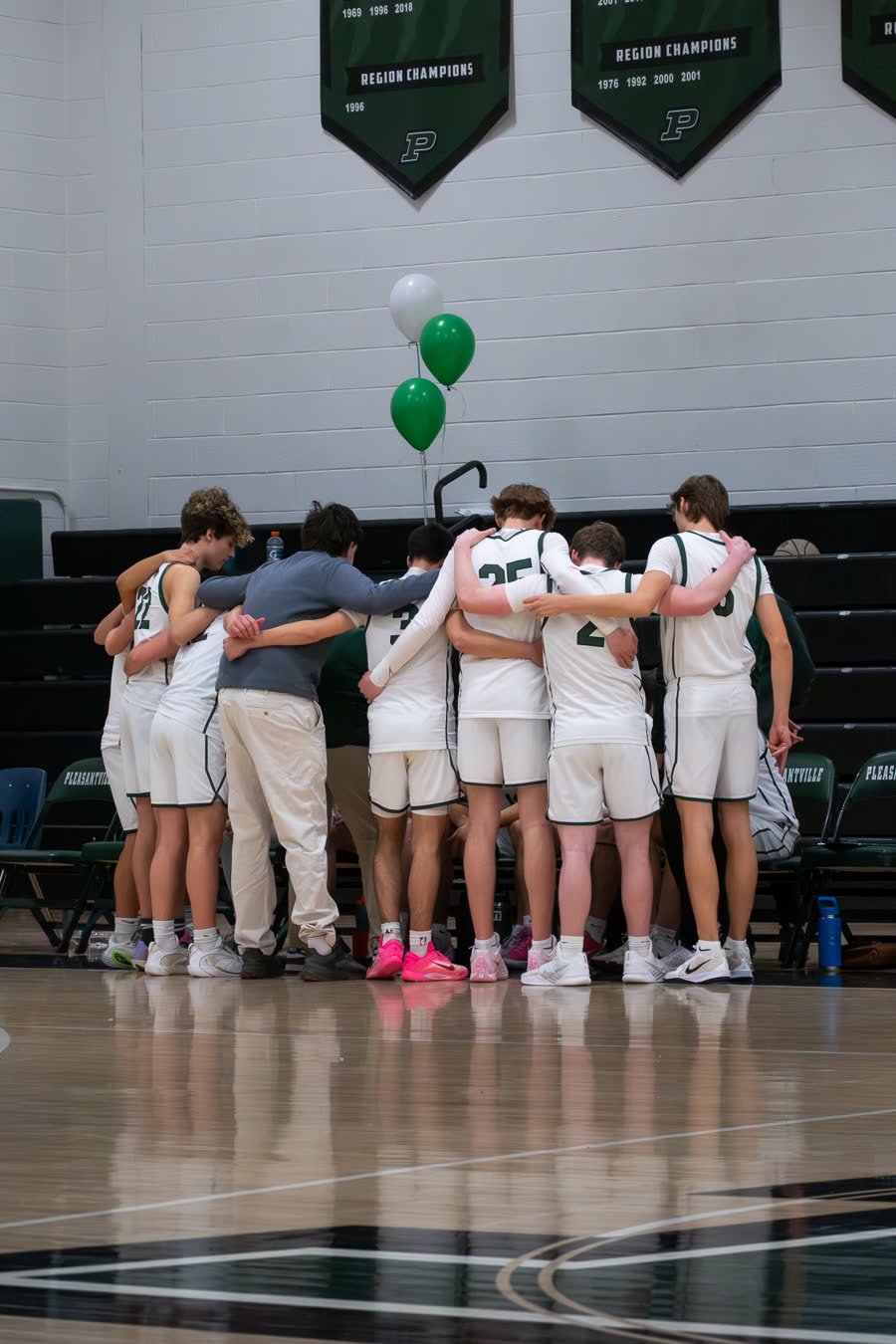 A team huddle at center court