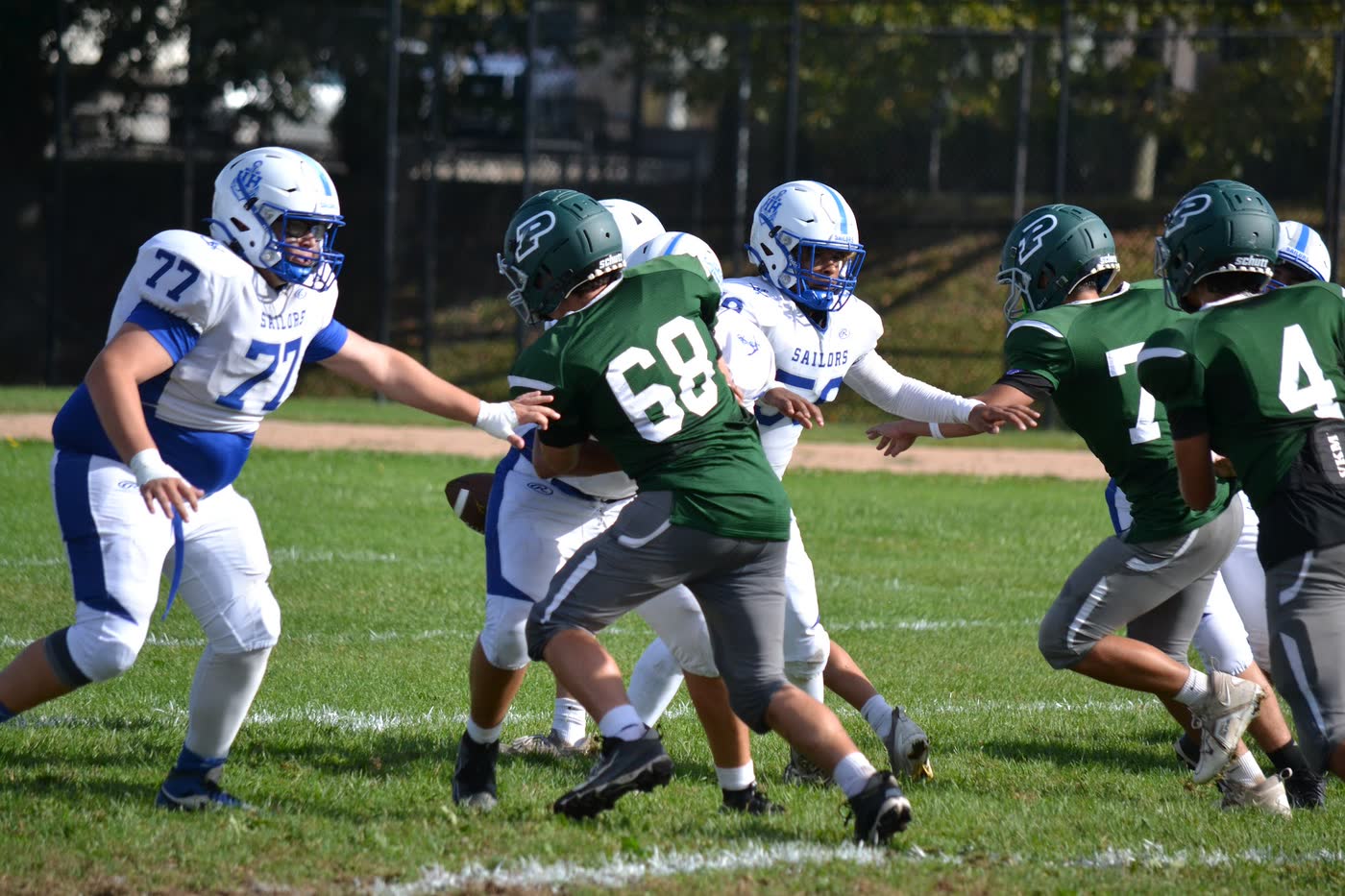 Pleasantville football line play during a game