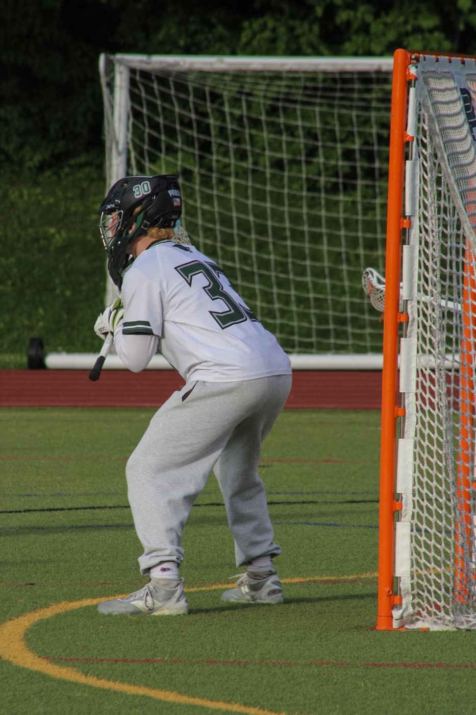 Jack Crombie set in the crease beside the cage